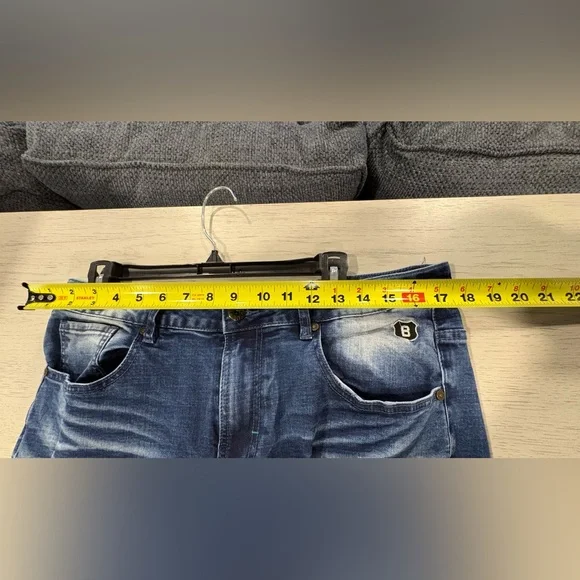 Stylish Blue Jeans with Olive Embroidered Accents - Picture 4 of 16